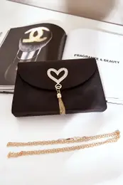 marka niezdefiniowana Clutch Bag With Decorative Heart Eco Suede Black Evilinas